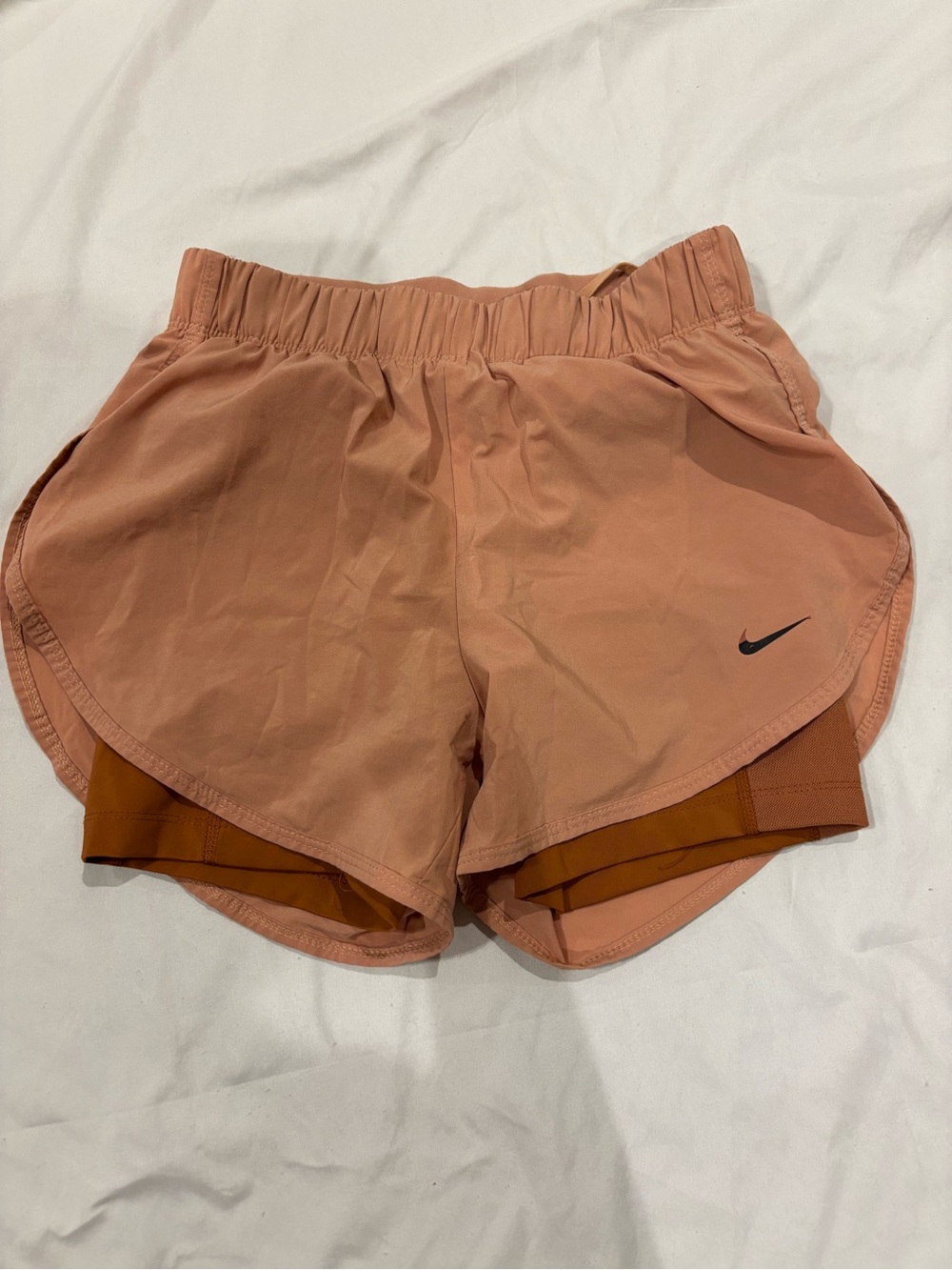 Nike Women's Peach-Pink Layered Athletic Shorts with Black Swoosh